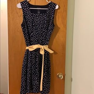 Navy polka dot dress with yellow sash